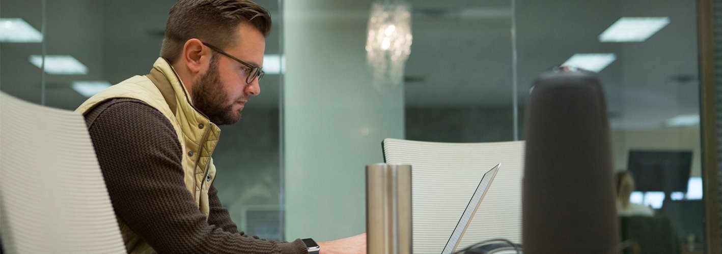 marketer working on his laptop